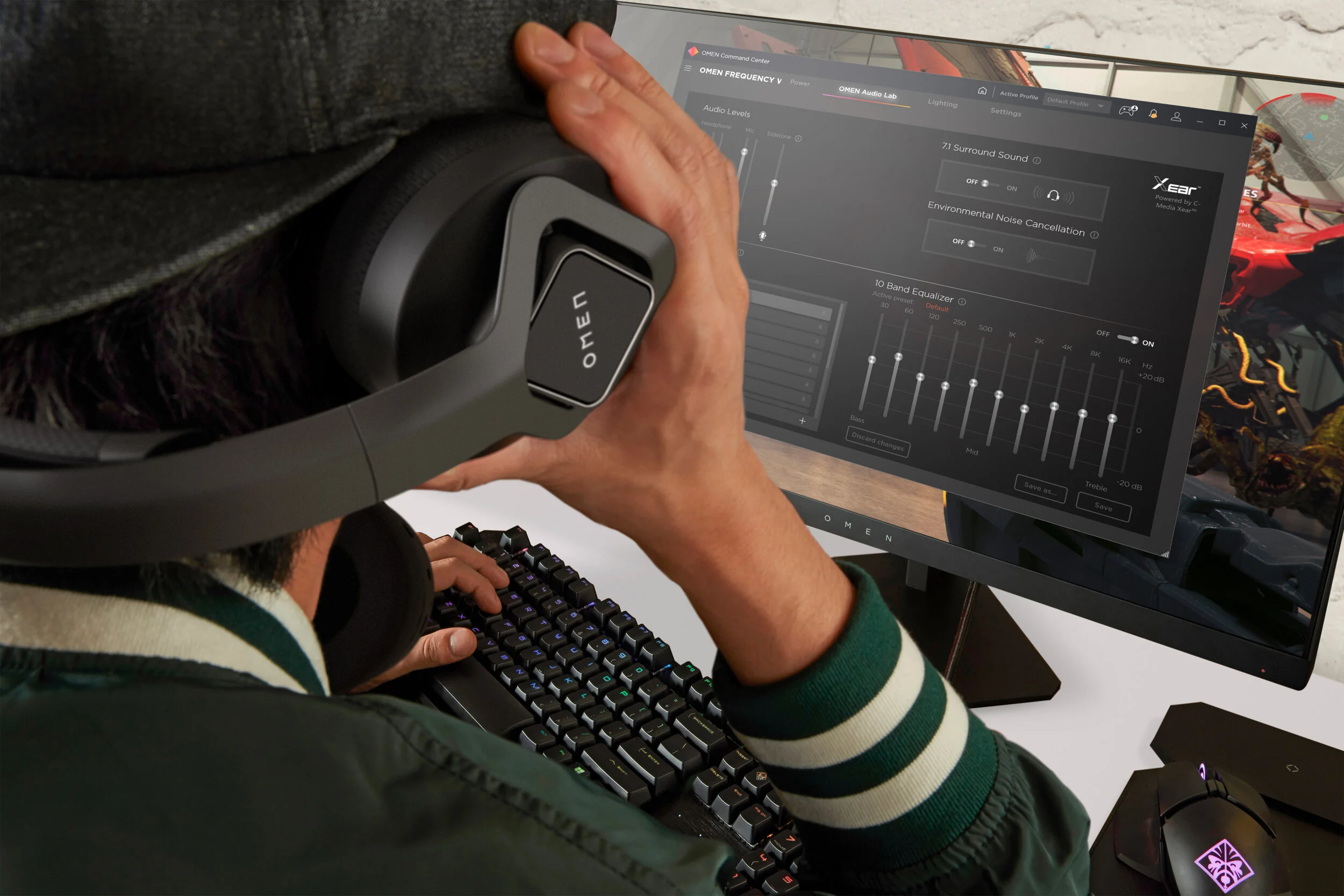 Gamer adjusting a headset beside an ultrawide monitor