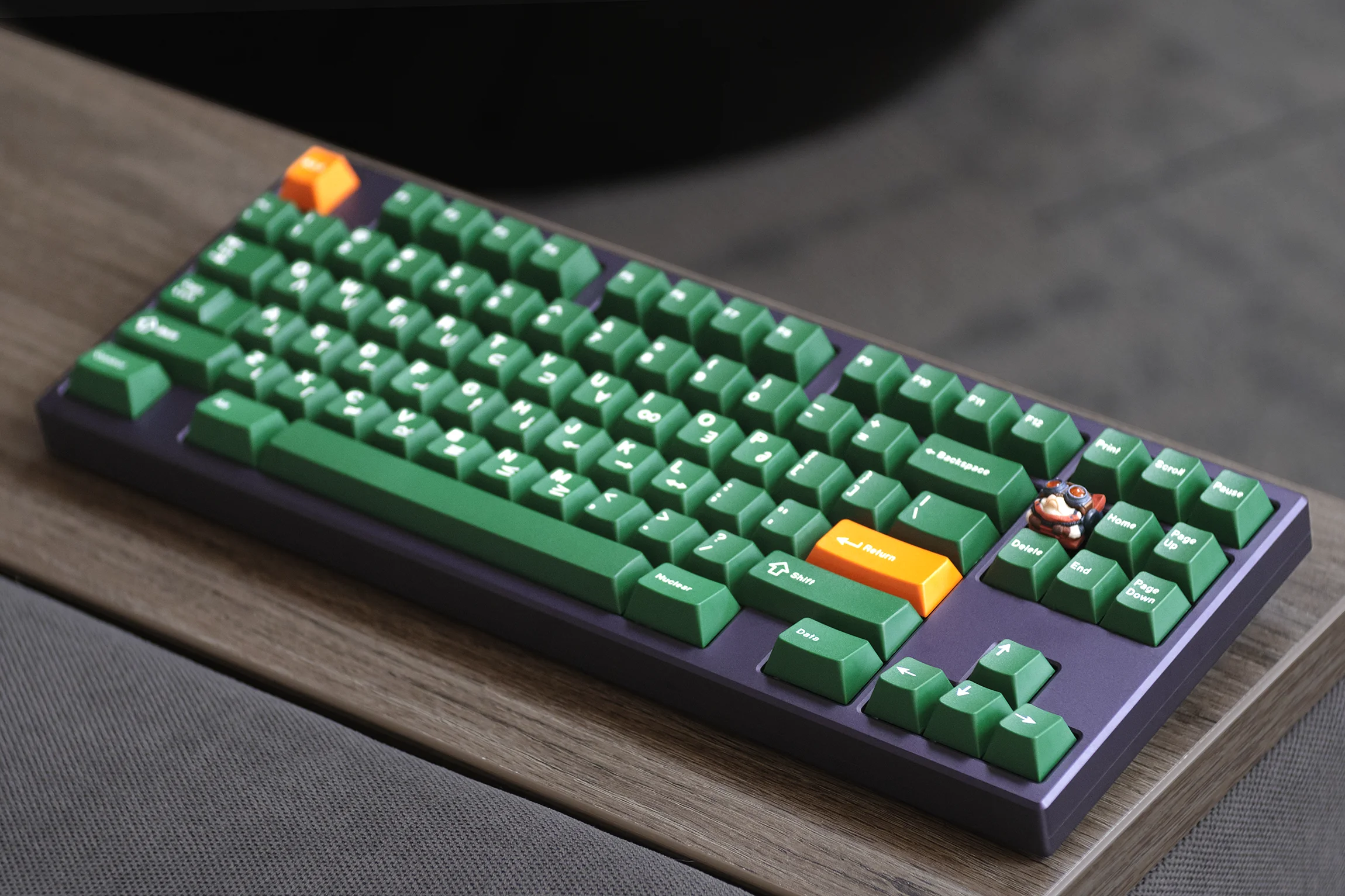 Green mechanical keyboard with orange accent keys