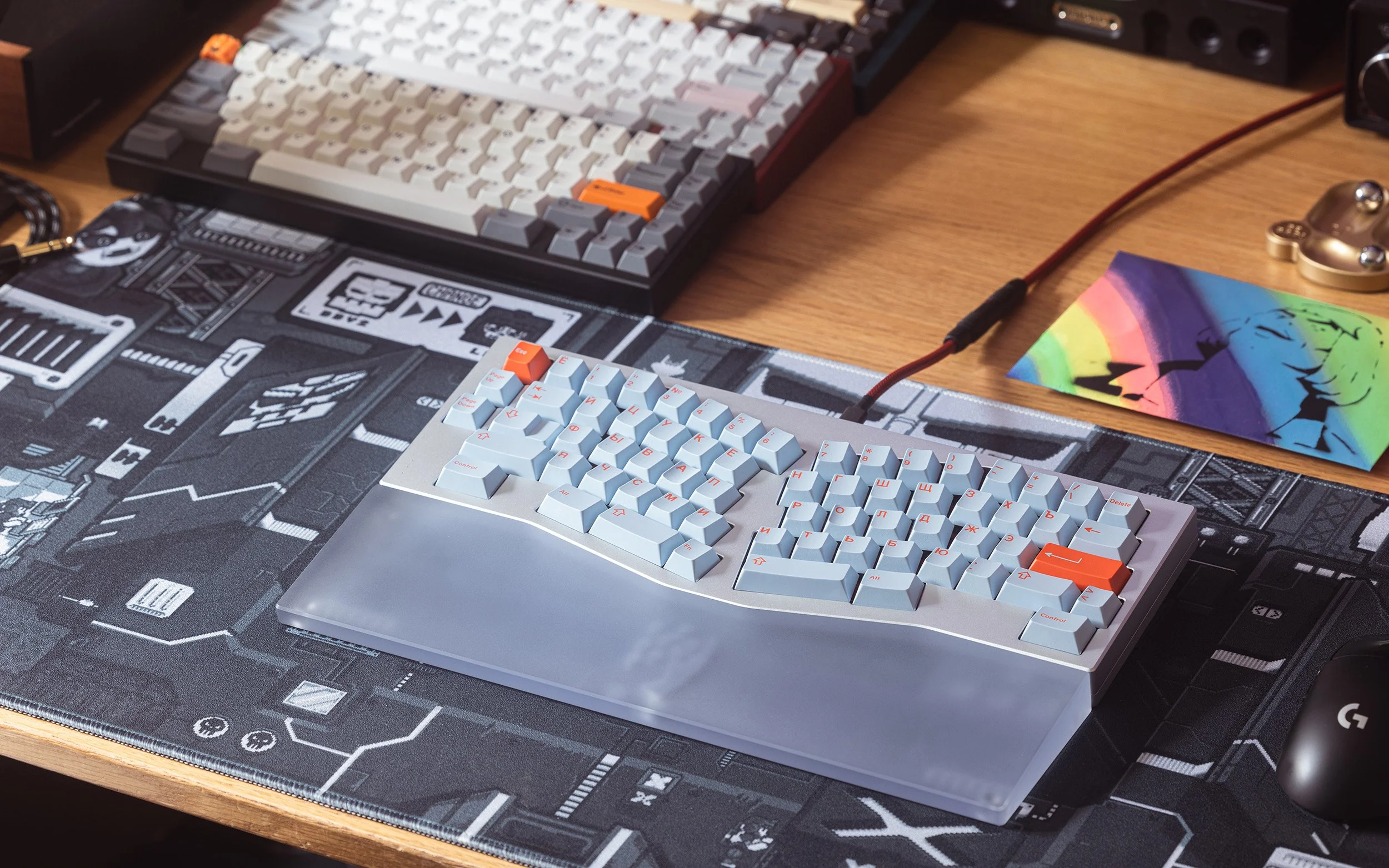 Custom keyboards arranged over printed design drawings
