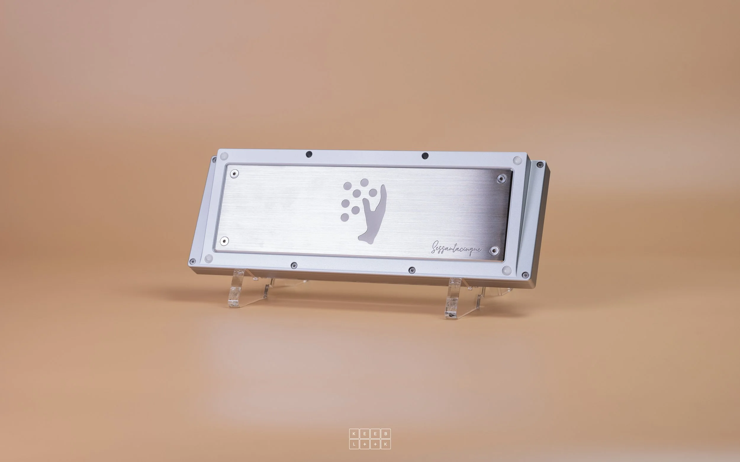 Silver keyboard base plate displayed on clear stands